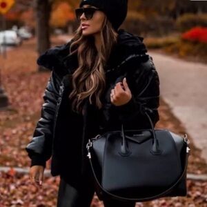 Express reversible vegan leather and faux fur puffer jacket in black.